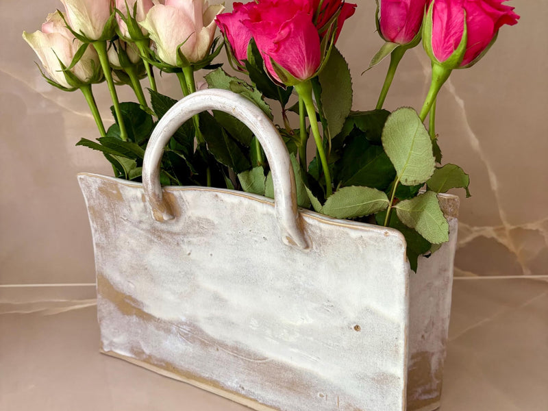 Handmade ceramic Bag Vase by Lusolia, stoneware shaped like a soft tote with gold and bronze glaze pooling along the base