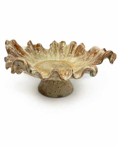 Golden Bloom, a handmade ruffled ceramic bowl on a pedestal, cream glaze with amber pooling